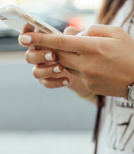 woman-holding-i-phone-during-daytime.jpg woman holding iPhone during daytime